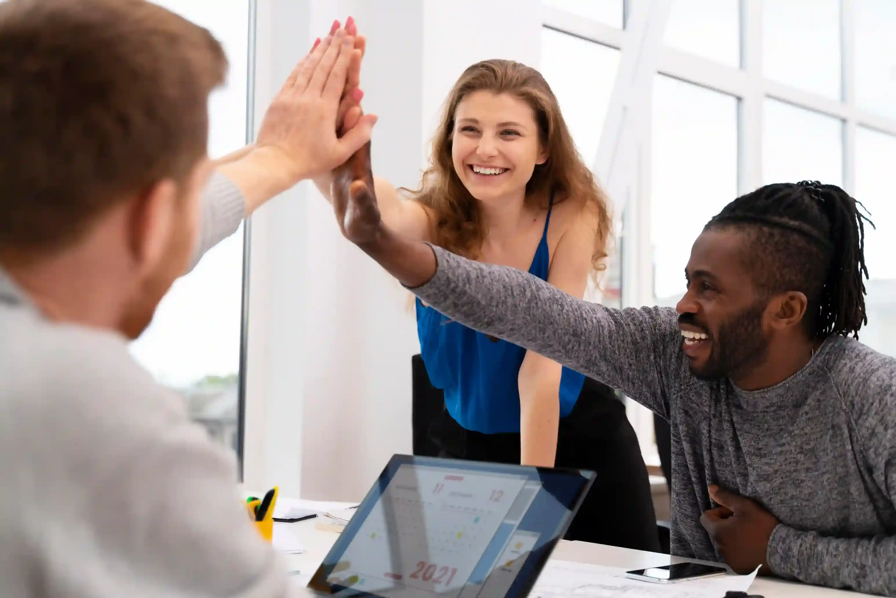 workers-high-five-close-up